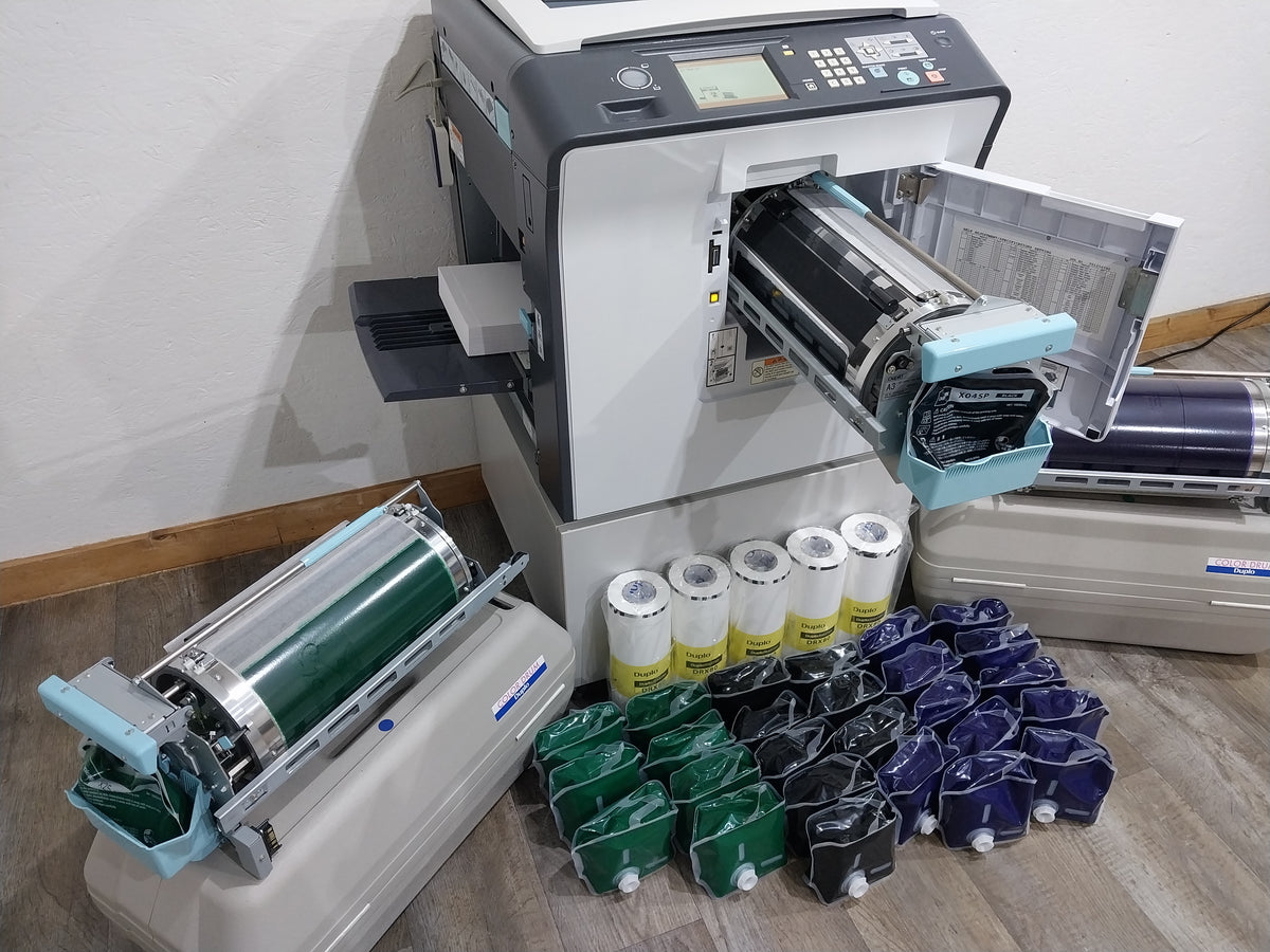 Duplo DP-X850 Digital Duplicator with Three Print Cylinders, Extra Supplies and Stand. Only 130K Total Prints!
