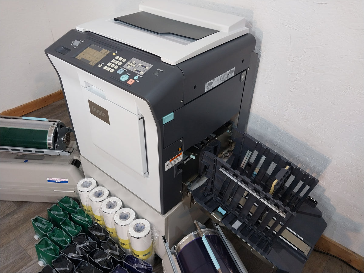 Duplo DP-X850 Digital Duplicator with Three Print Cylinders, Extra Supplies and Stand. Only 130K Total Prints!