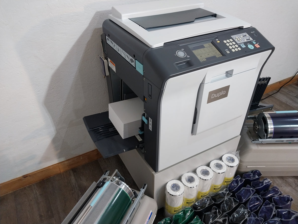 Duplo DP-X850 Digital Duplicator with Three Print Cylinders, Extra Supplies and Stand. Only 130K Total Prints!